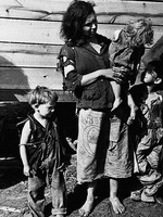 The mother and some of the children of af amily of nine living in a field along US Highway No. 70. Near the Tennessee River, Tennessee, March 1936